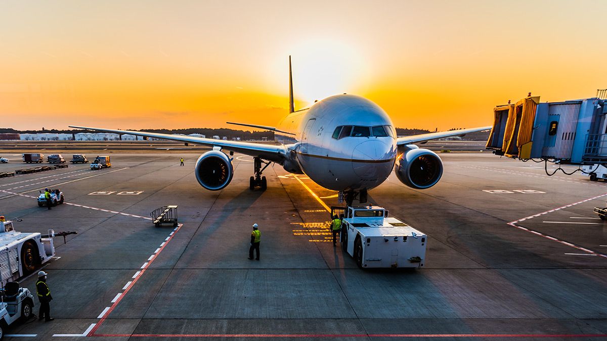Airplane unloading on runway
